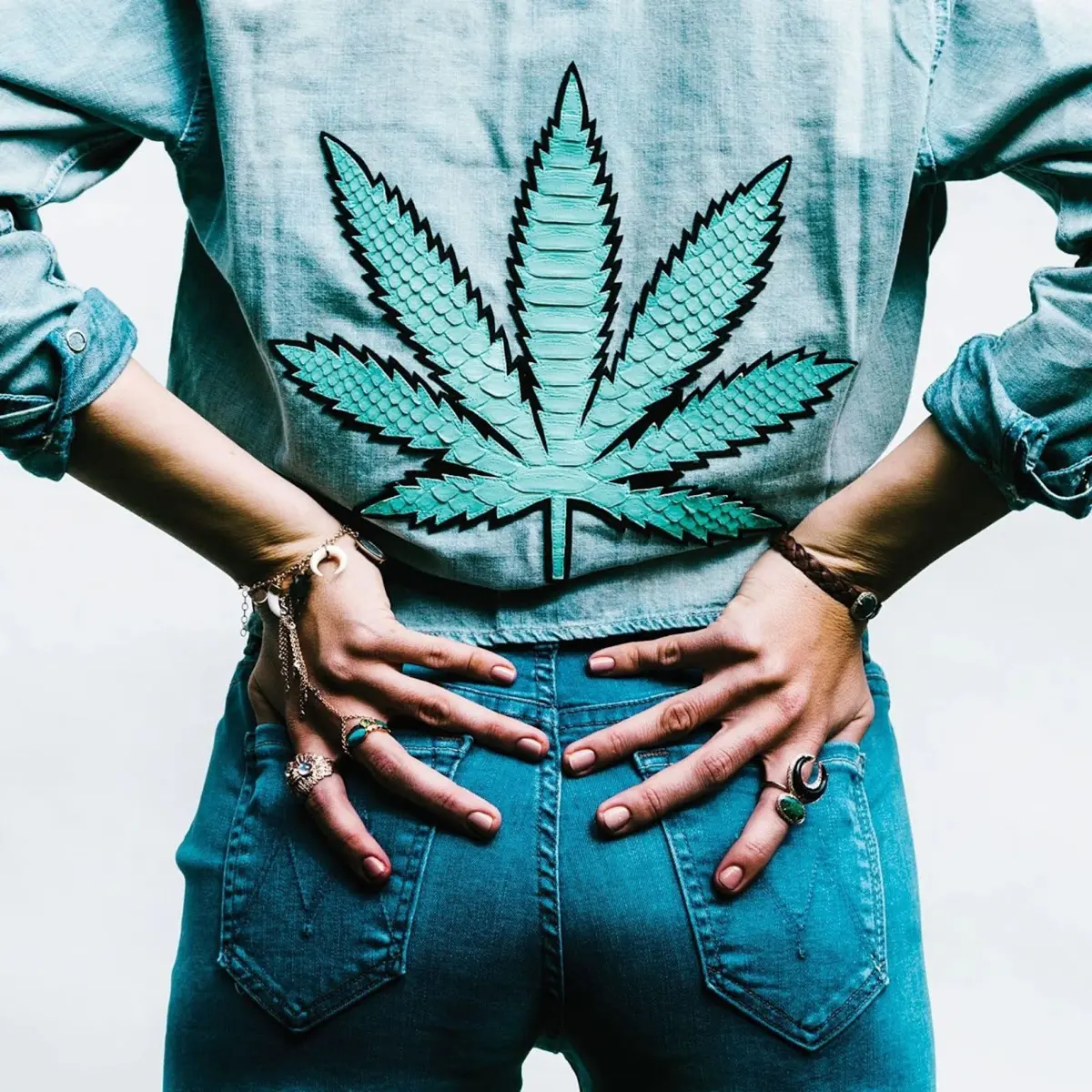 Close-up behind shot of a woman wearing a hemp printed denim jacket