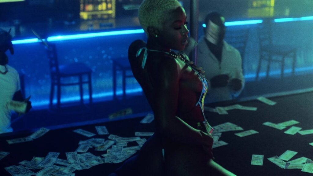Close up of Magic City dancer on stage surrounded by dollar bills